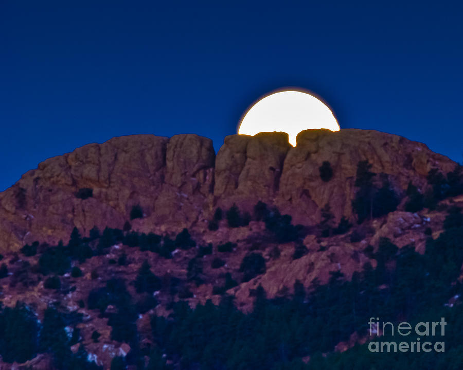 Moon Setting Behind Horsetooth Rock Photograph by Harry Strharsky