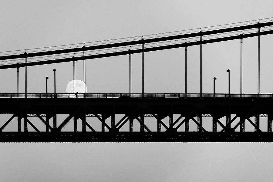 Moonlight Ride -- Bicyclist on the Golden Gate Bridge in San Francisco, California Photograph by Darin Volpe