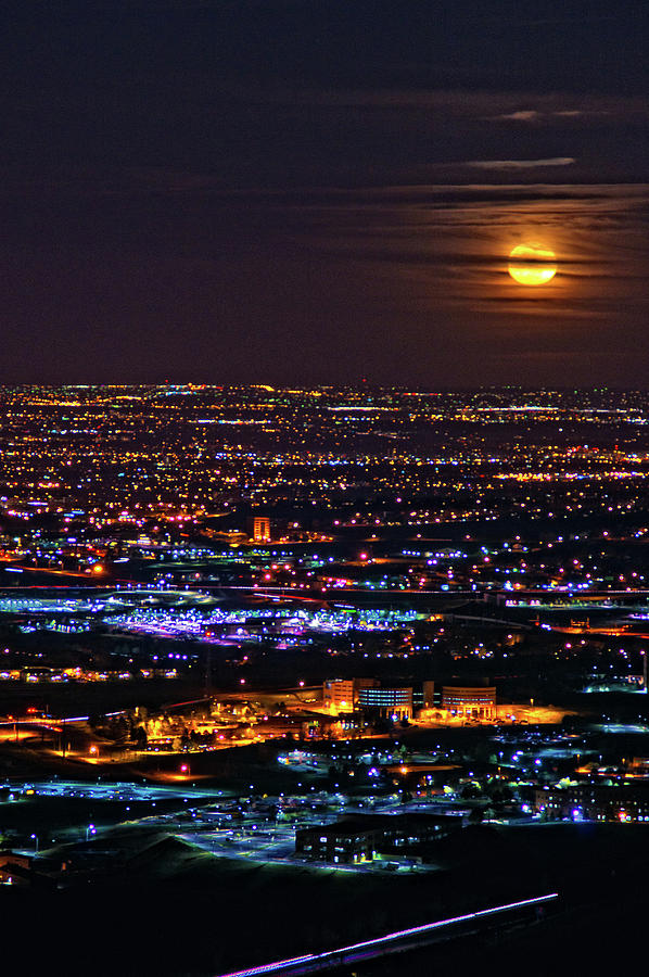Moonrise Above The City Photograph by John De Bord