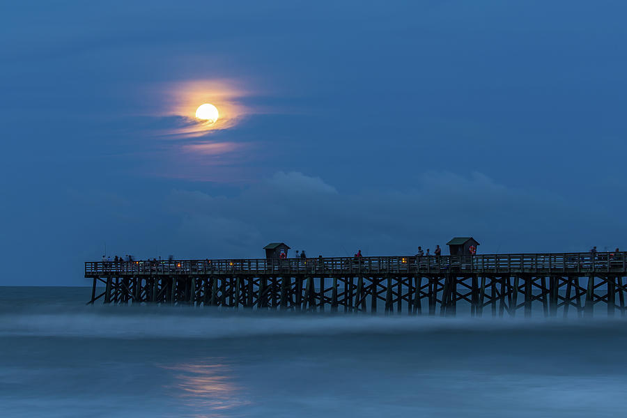 Moonrise over Flagler Beach pier Photograph by Stefan Mazzola