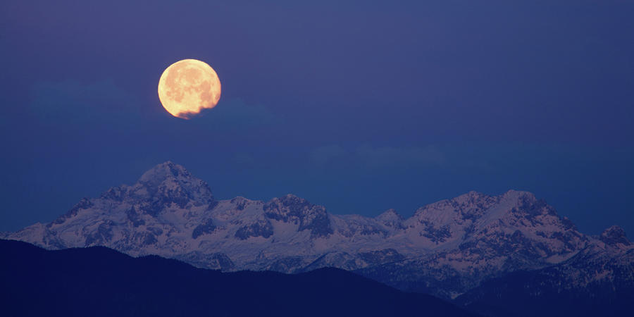 Moonset over the Julian Alps Photograph by Ian Middleton