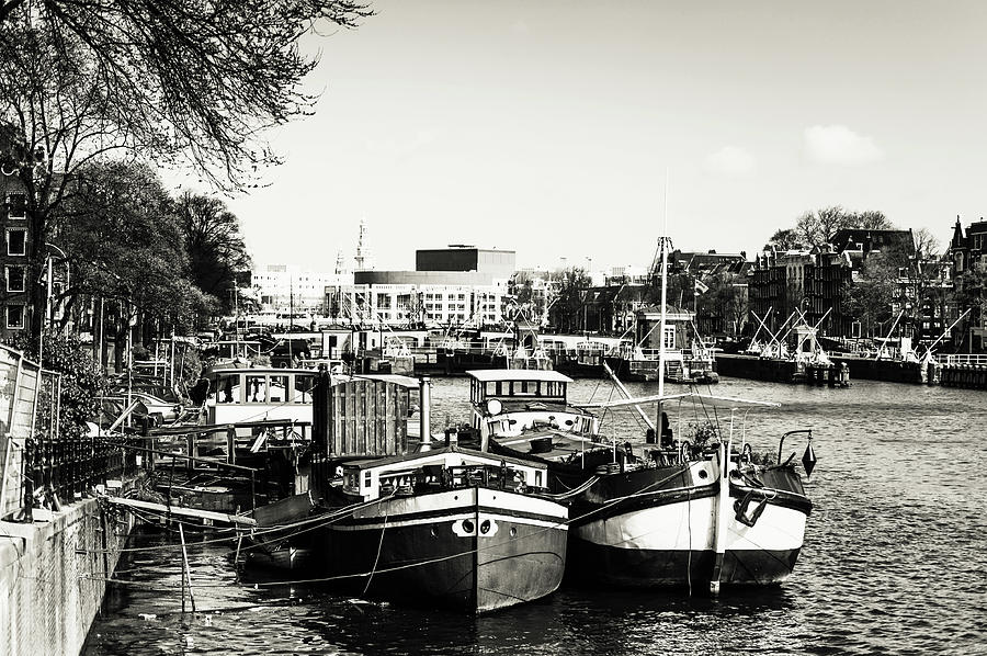 Moored Boats at Amsterdam Canal. Monochrome Photograph by Jenny Rainbow