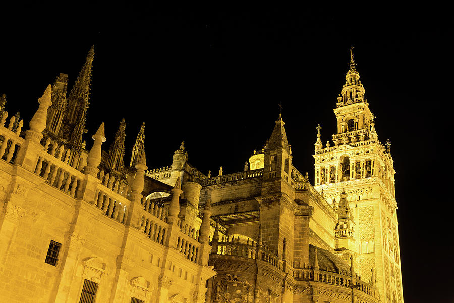 Moorish and Gothic Intertwined - La Giralda and Seville Cathedral Illuminated View Photograph by Georgia Mizuleva