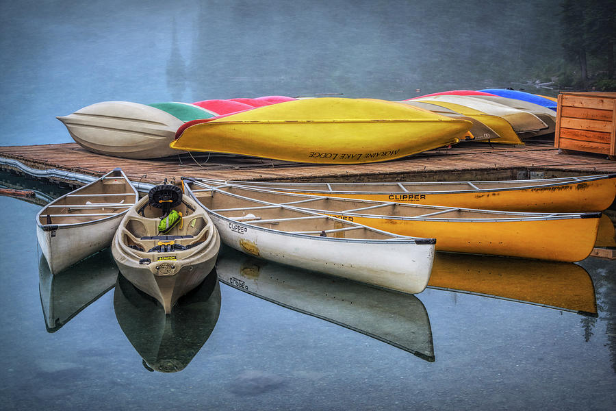 Moraine Lake Canoes Photograph by Joan Carroll