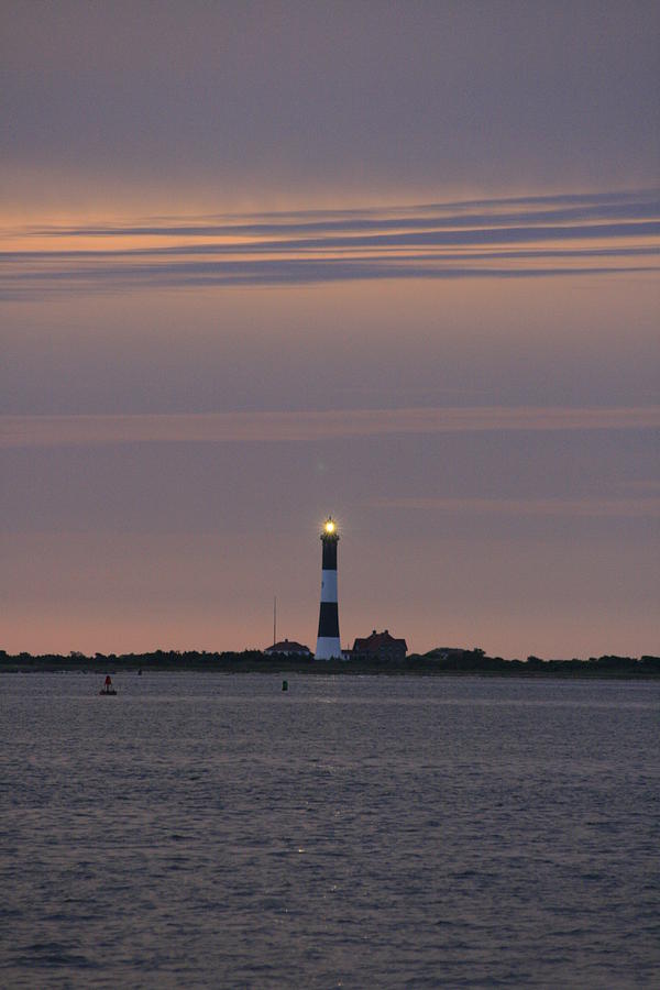 Morning flash of Fire Island Light Photograph by Christopher J Kirby