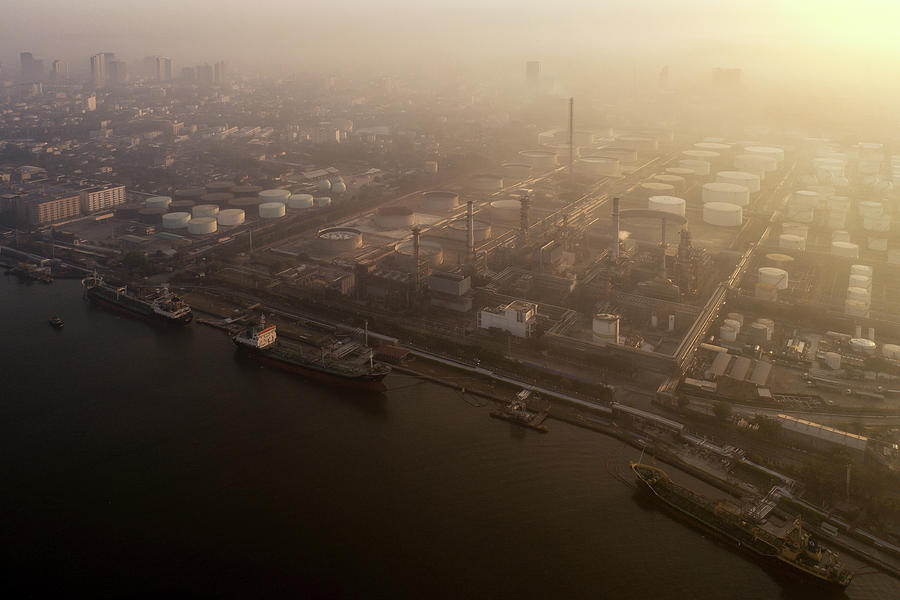Morning Sunrise over petro chemical and oil refinery plant Photograph by Anek Suwannaphoom