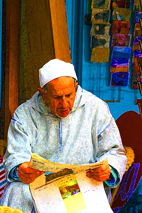 Moroccan with newspaper Photograph by Mitch France