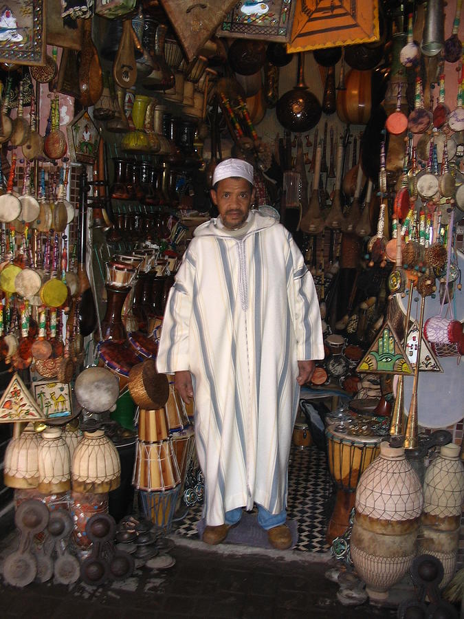 Morocco Marrakesh Street seller Photograph by Yvonne Ayoub