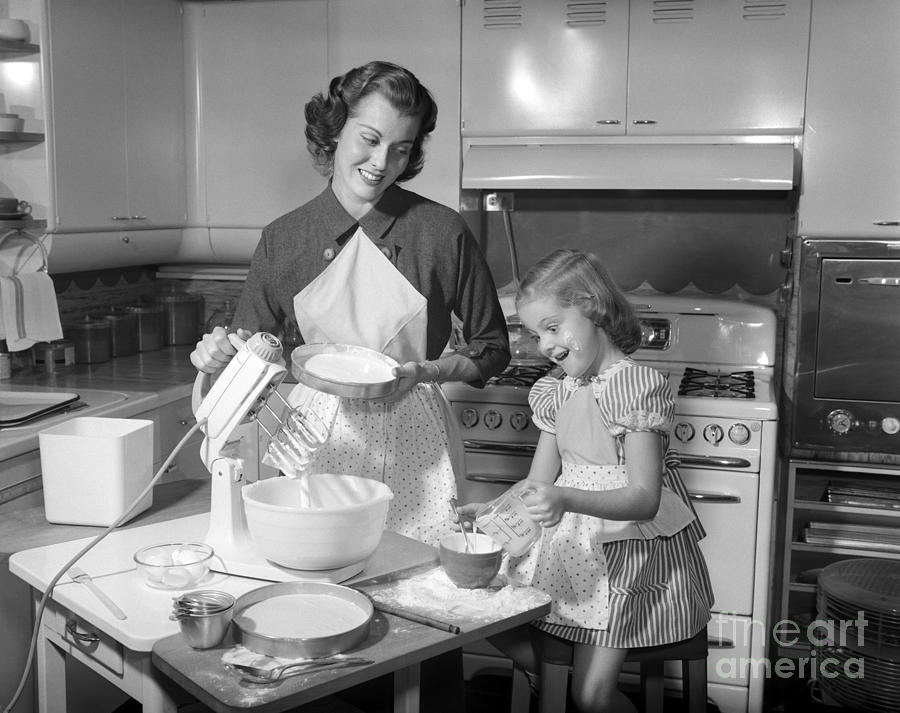 Mother And Daughter Baking A Cake Photograph by Debrocke/ClassicStock
