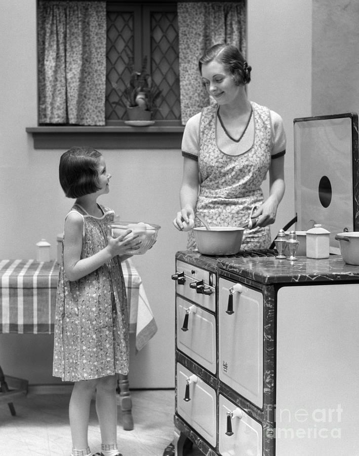 Mother And Daughter Cooking, C.1920s Photograph by H ...
