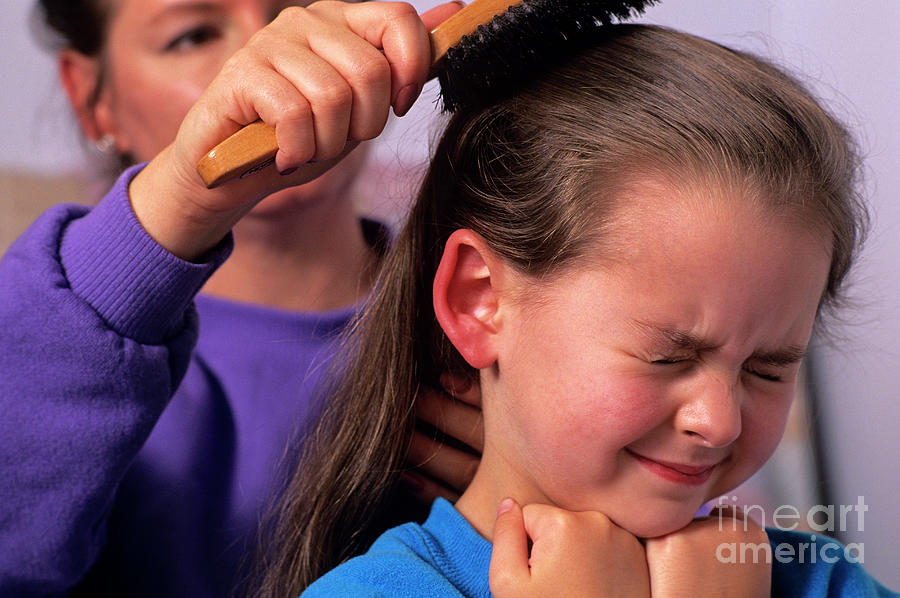 Mother Combing Daughters Hair Photograph by Jim Corwin