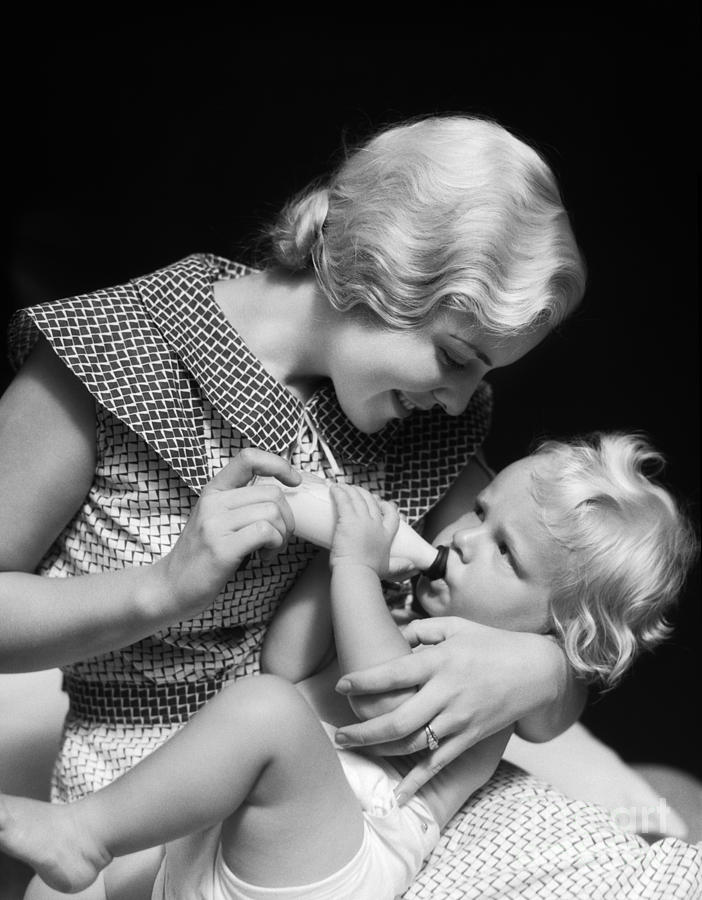 Mother Feeding Baby, 1930s Photograph by H. Armstrong Roberts/ClassicStock