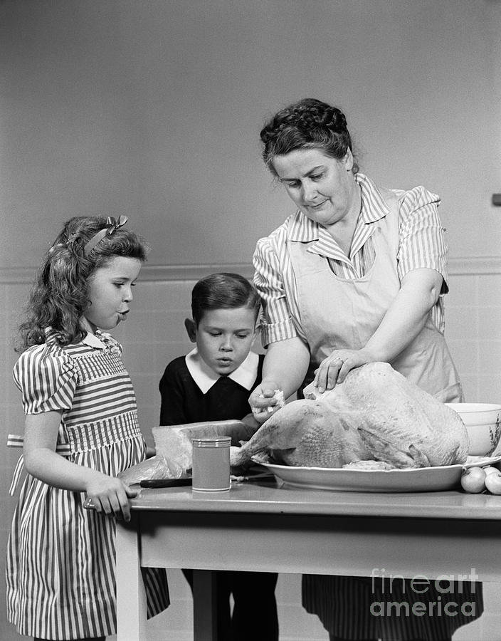 Mother Stuffing Thanksgiving Turkey Photograph by H. Armstrong Roberts/ClassicStock