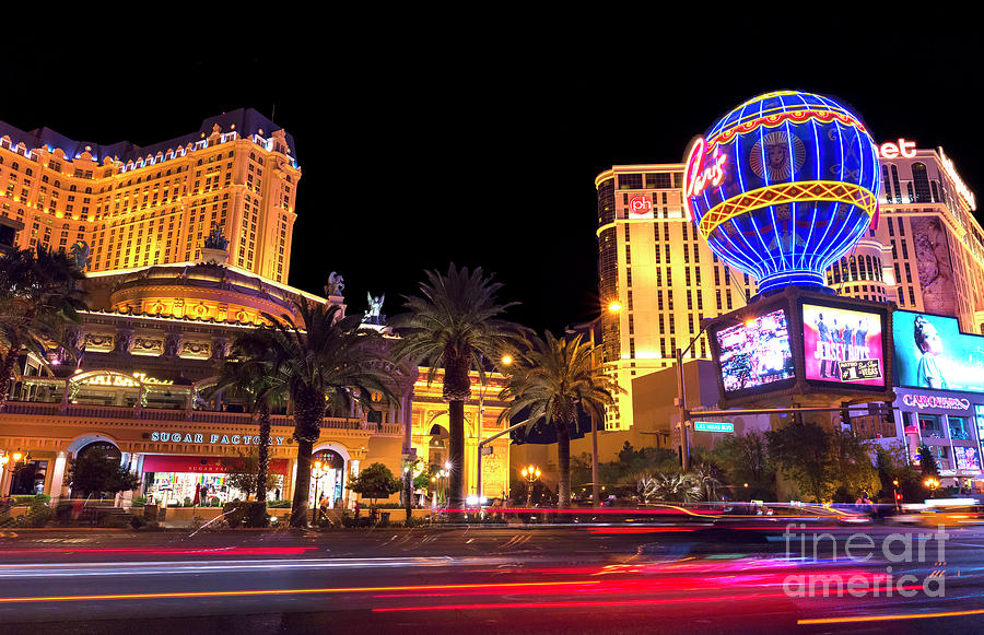Motion on the Strip at Night Photograph by John Rizzuto