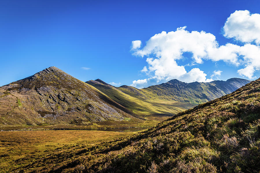 Mountain range and valleys in Kerry in Ireland on a sunny day wi Photograph by Semmick Photo