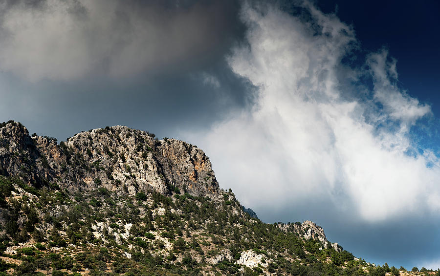 Mountain range peak covered  with dramatic clouds Photograph by Michalakis Ppalis