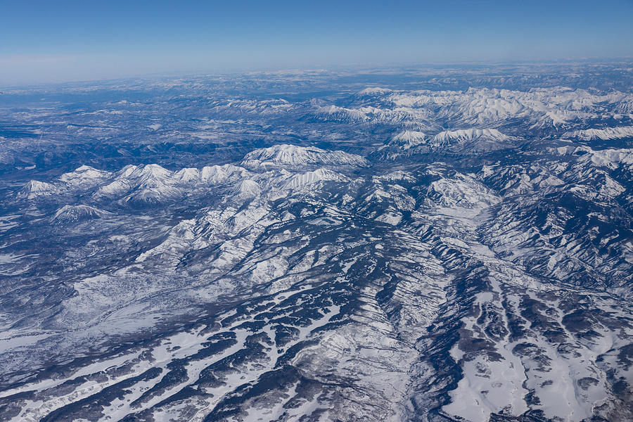 Mountains as Far as the Eye Can See - Winter Flight Over the Rockies Photograph by Georgia Mizuleva