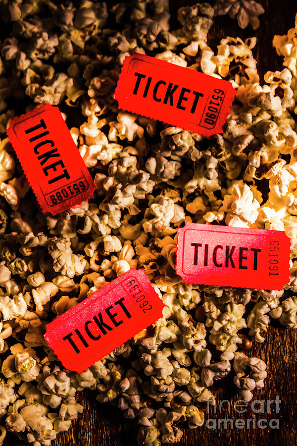 Movie tickets on scattered popcorn Photograph by Jorgo Photography
