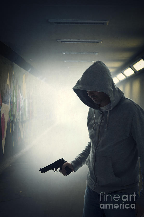 Mugger With Weapon Waits In An Urban Subway Photograph by Lee Avison