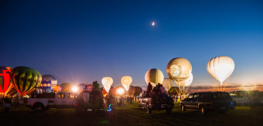 Multiple Hot air Balloons night glow Photograph by Charles McCleanon