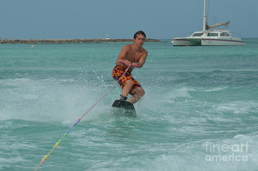 Muscular Young Guy Wakeboarding Off the Coast of Aruba Photograph by DejaVu Designs
