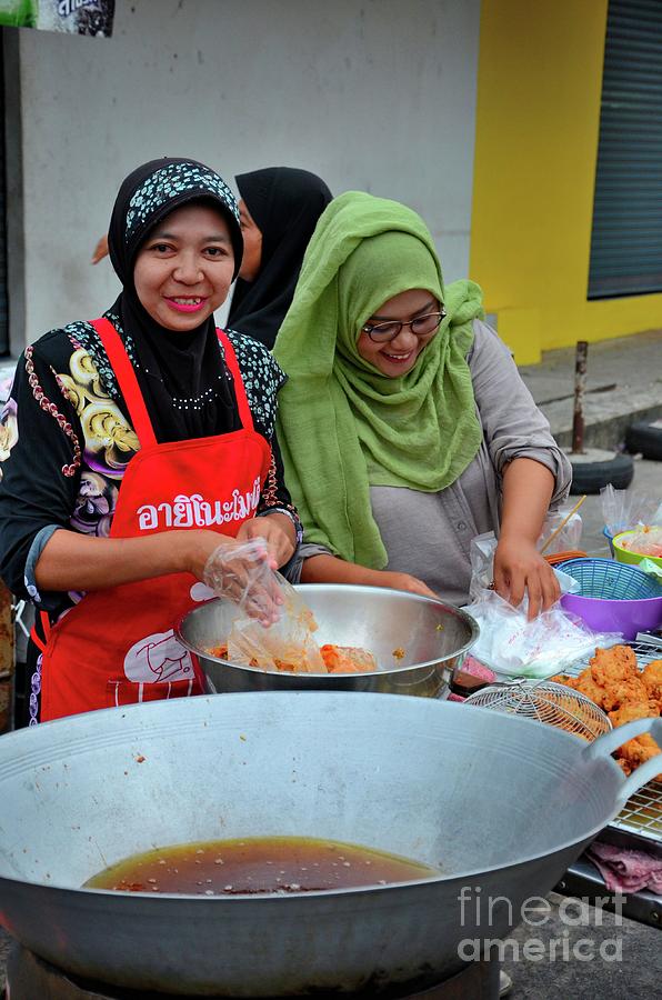 Muslim Thai women cook at street stall at food street bazaar Pattani Thailand Photograph by Imran Ahmed