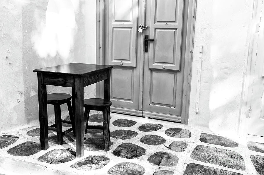 Mykonos Table and Chairs Monochrome Photograph by John Rizzuto