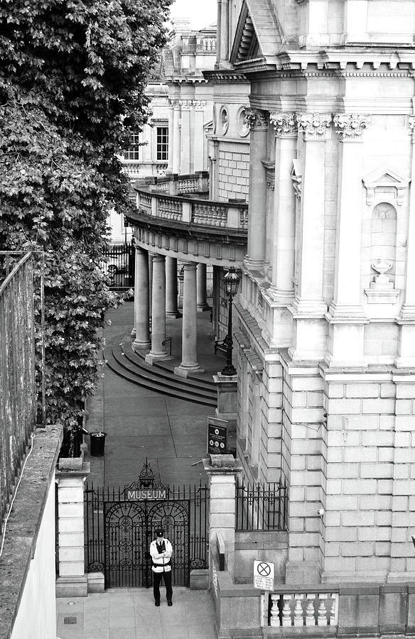 National Museum of Archeology Side Entrance Gate and Garda Dublin Ireland Black and White Photograph by Shawn OBrien
