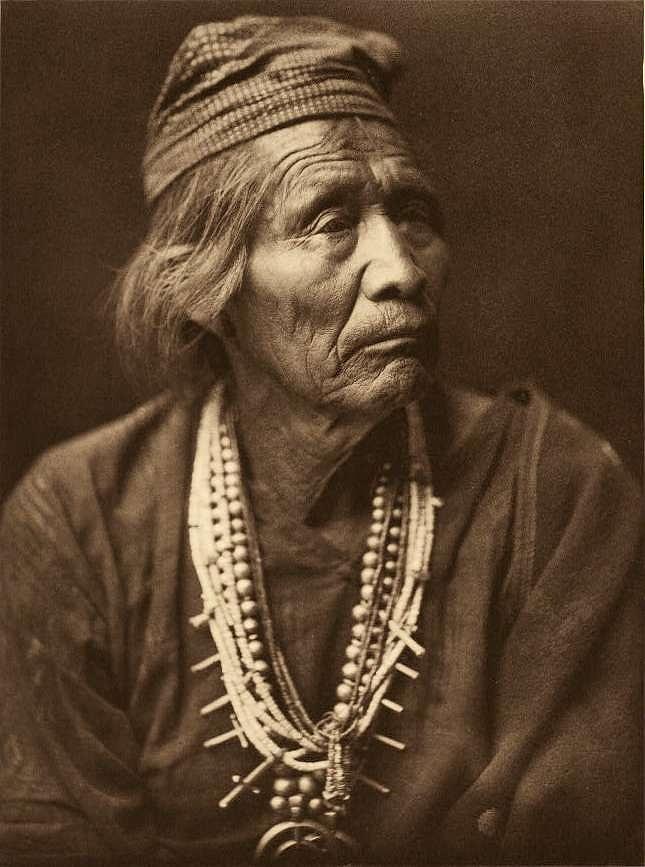 Navajo medicine man  Nesjaja Hatali, c. 1907 by  Edward S. Curtis. USA, 1900 Painting by Celestial Images