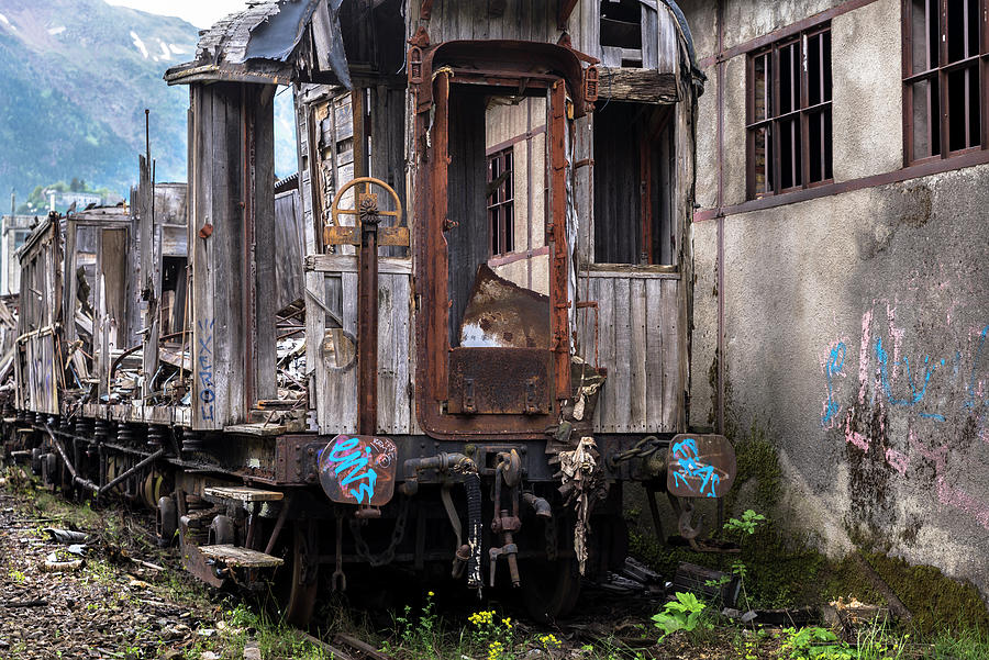 Neglected train and warehouse in the abandoned Canfranc International Railway Station Photograph by RicardMN Photography
