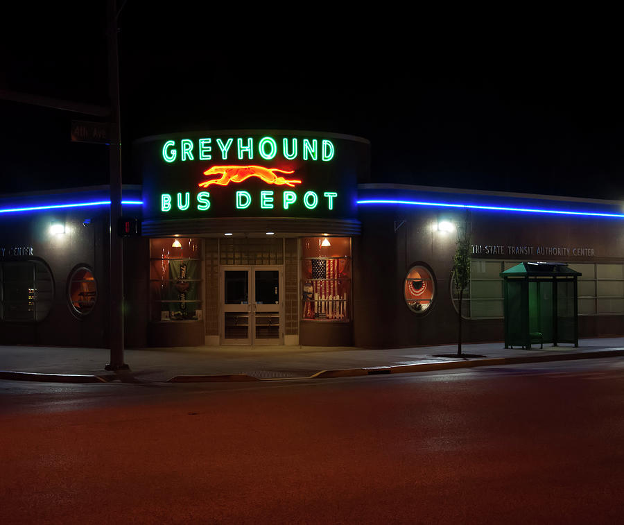Greyhound Photograph - Neon Greyhound bus depot sign by Flees Photos
