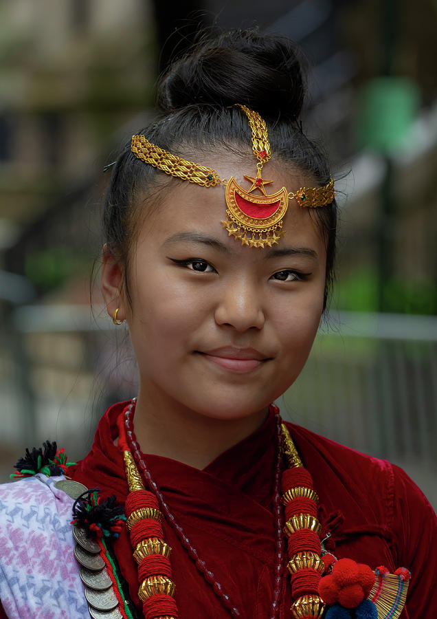 Nepali woman in Nepali cultural dress holding a green Khutruke/Gullak for  saving and deposit concept - Photos Nepal