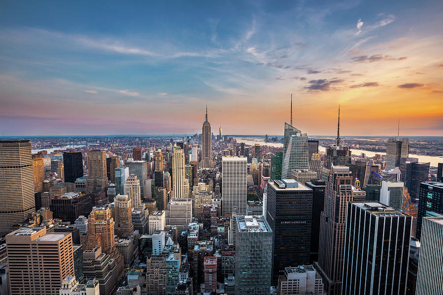 New York City midtown skyline at sunset. Photograph by Kan Khampanya ...