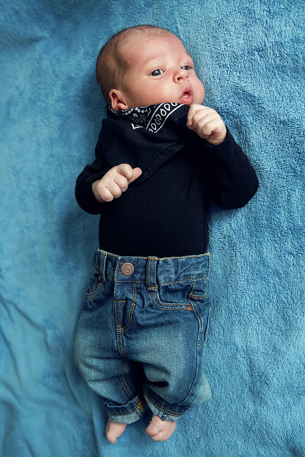 Newborn Baby Lying In Blue Jeans And A Black Scarf by Elena Saulich