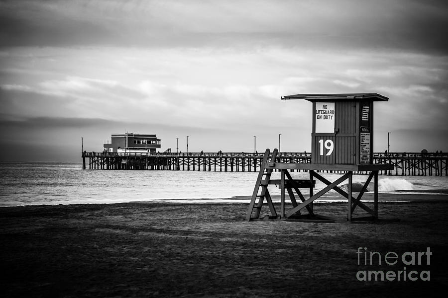 Newport Pier and Lifeguard Tower in Black and White Photograph by Paul Velgos