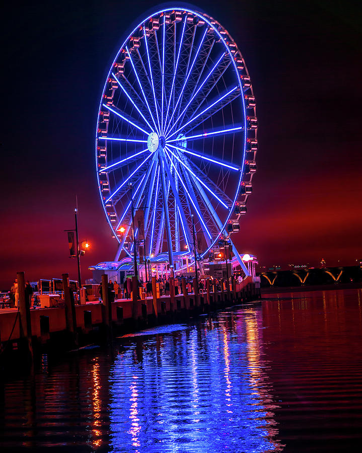 Ferris Photograph - Night at the National Harbor by Brian James