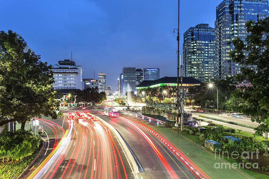 Night traffic in downtown Jakarta, Indonesia capital city.  Photograph by Didier Marti