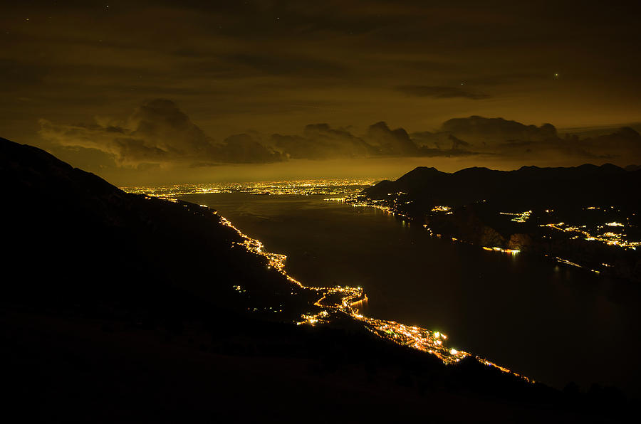 Nature Photograph - Night view of lkae Garda from Monte Baldo by Nicola Aristolao