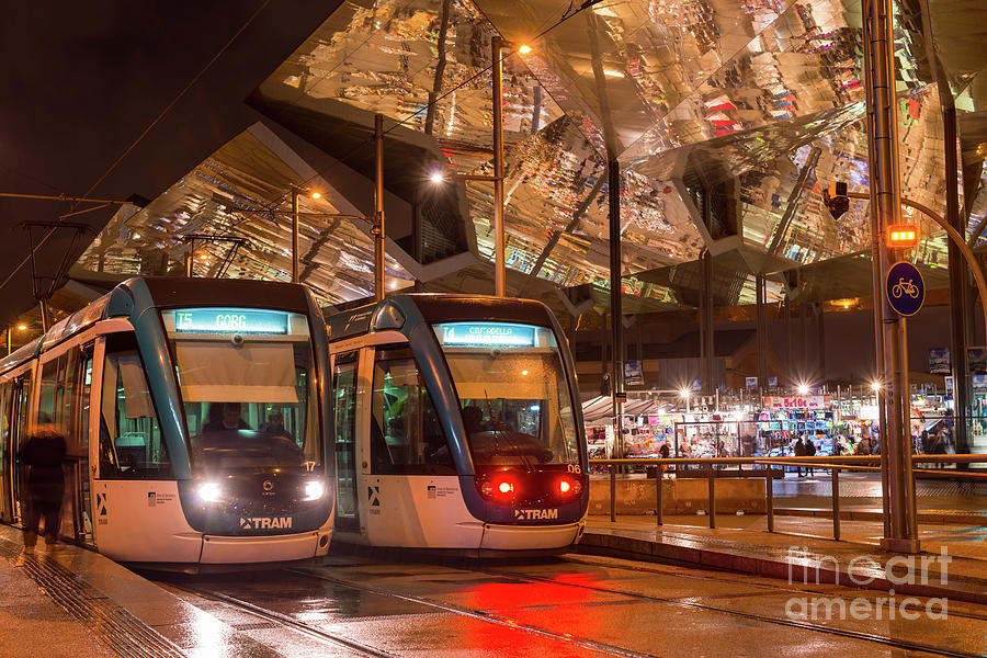Night view of two trams at Glories station  Photograph by Andrew Michael