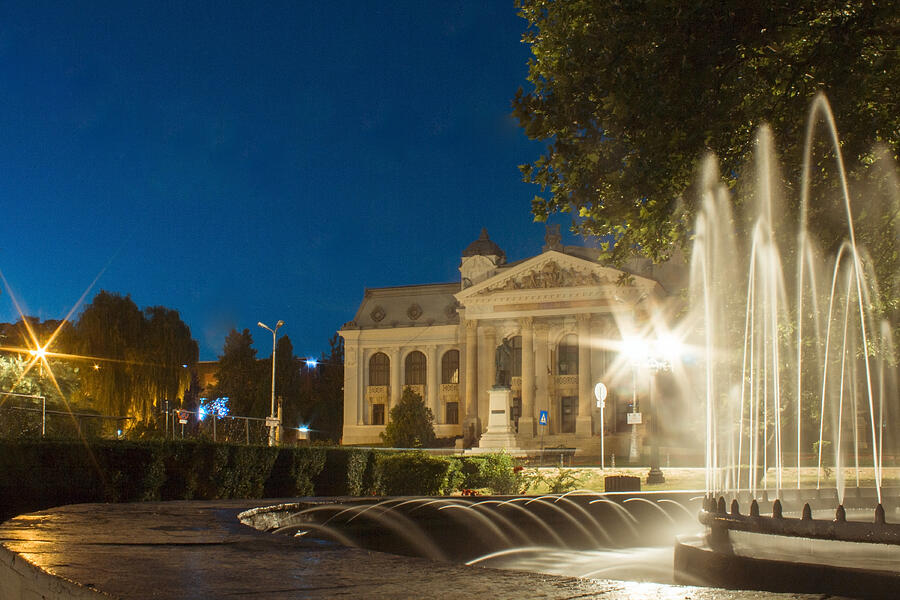 Night view with fountain city lights and National Theatre Vasile Alecsandri in Iasi ROMANIA Photograph by Vlad Baciu
