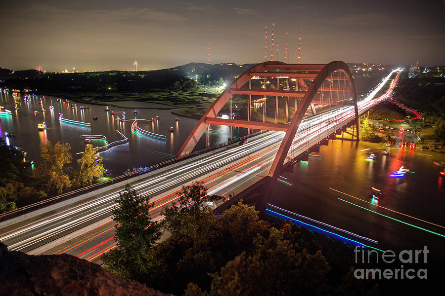 Boat Photograph - Nighttime boats cruise up and down the Loop 360 Bridge, a boater by Dan Herron