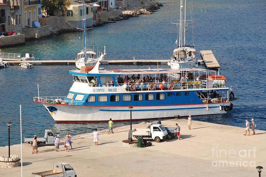 Nikos Express docking at Halki Photograph by David Fowler