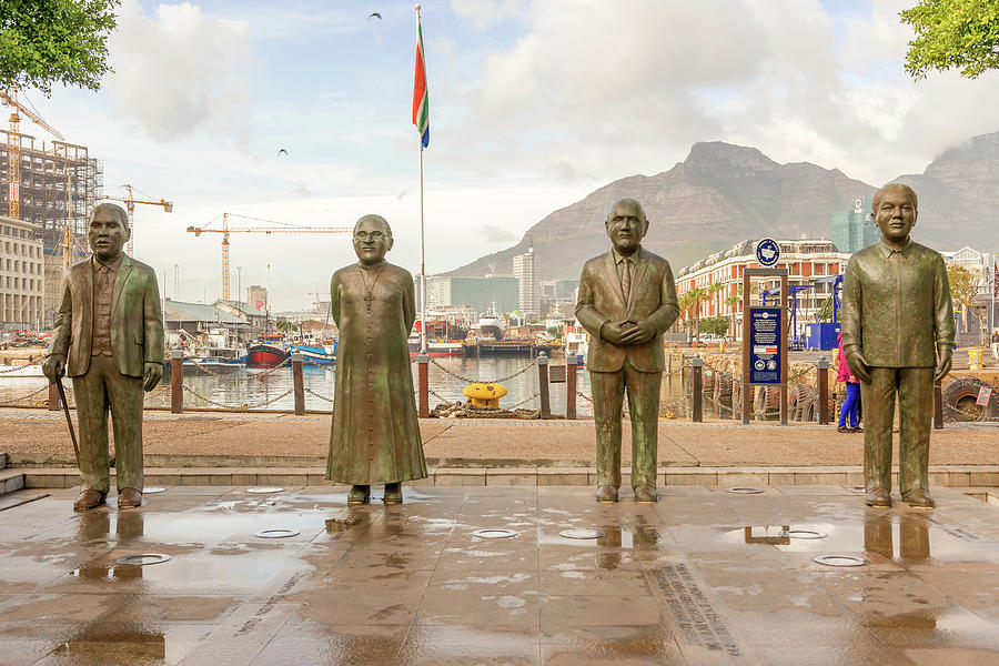 Nobel Square at waterfront in Cape Town with the four statues of Photograph by Marek Poplawski