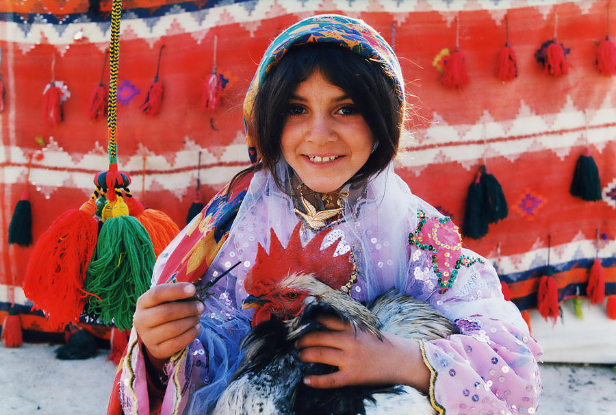 Nomad Girl Holding a Rooster Photograph by Salma