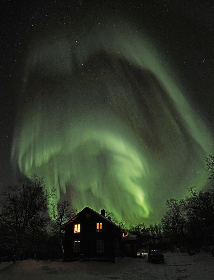 Northern Lights Embrace an Old House Photograph by Pekka Sammallahti