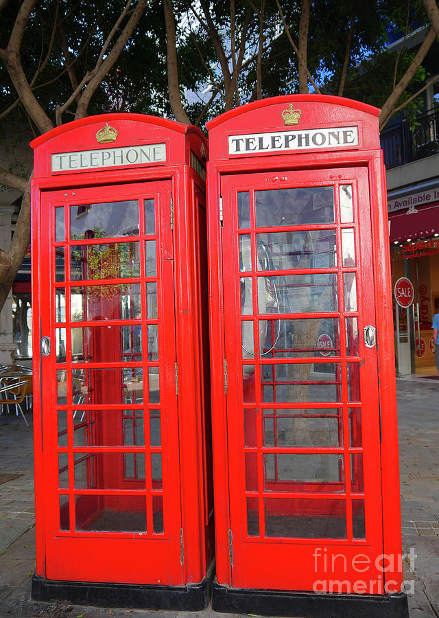 Not quite identical twin phone boxes in Gibraltar Photograph by Brenda Kean