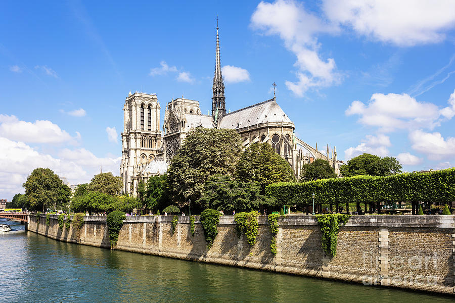 Notre Dame cathedral along the Seine in Paris Photograph by Didier Marti