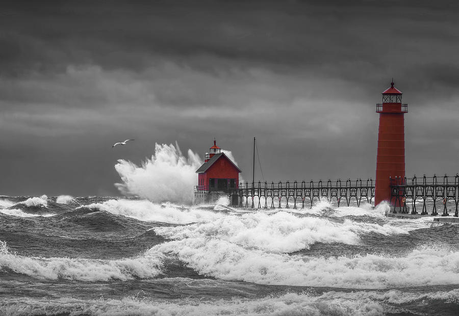 November Storm  with Flying Gull by the Grand Haven Lighthouse Photograph by Randall Nyhof