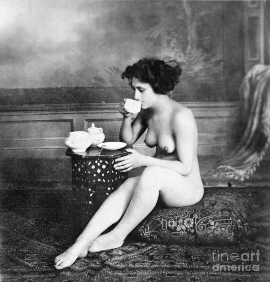 Drunking nudist-woman agefotostock