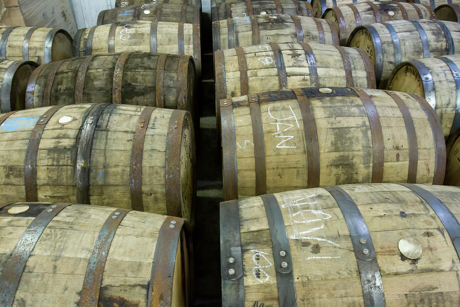 Oak barrels in bourbon distillery Photograph by Karen Foley